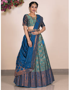 Woman wearing a blue and green lehenga with a matching blouse