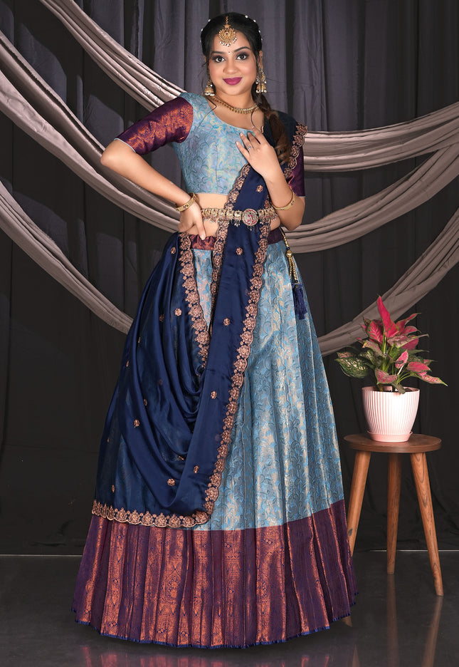 Woman in a traditional blue and purple outfit