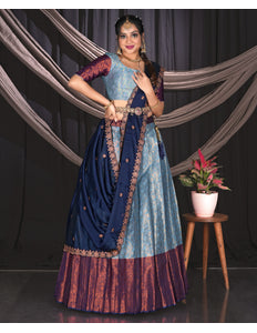 Woman in a traditional blue and purple outfit