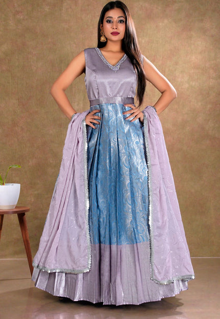 Woman wearing a two-tone dress with a gradient from blue to lavender