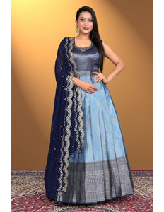 Woman wearing a sky blue traditional outfit with a blue dupatta