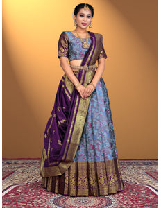 Woman wearing a traditional lehenga choli with a purple and blue color
