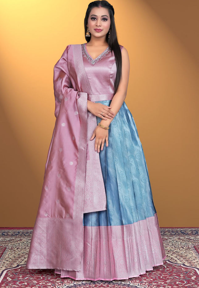 Woman wearing a two-tone pink and blue traditional outfit 