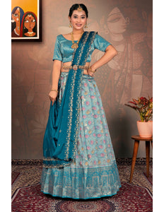 Woman in a sky blue traditional lehenga choli with dupatta
