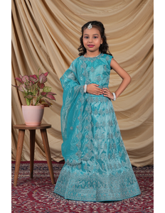 Young girl in a turquoise embroidered ready-made lehenga for girls