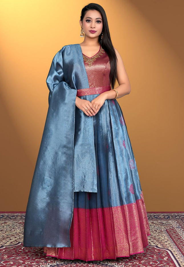 Woman wearing a traditional outfit with a blue and red dress