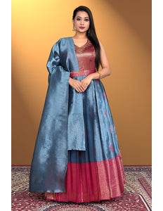 Woman wearing a traditional outfit with a blue and red dress