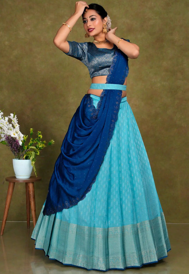 Woman in a blue and green traditional lehenga choli with dupatta