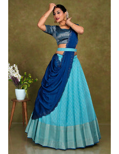 Woman in a blue and green traditional lehenga choli with dupatta