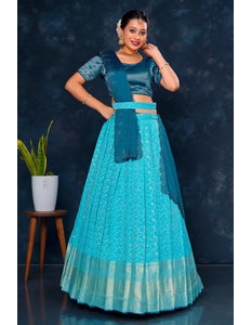 Woman in a teal traditional lehenga choli with dupatta