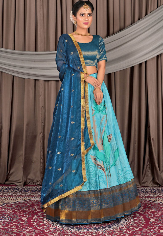 Woman wearing a traditional blue outfit with gold accents