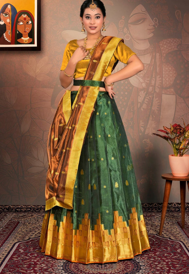 Woman in a green and gold traditional lehenga choli with dupatta