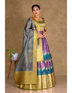 Woman wearing a traditional half saree with a multicolor design