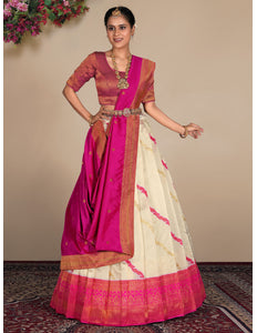 Woman wearing a traditional lehenga with pink and white design