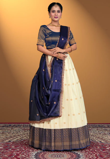 Woman wearing a traditional navy and white lehenga choli