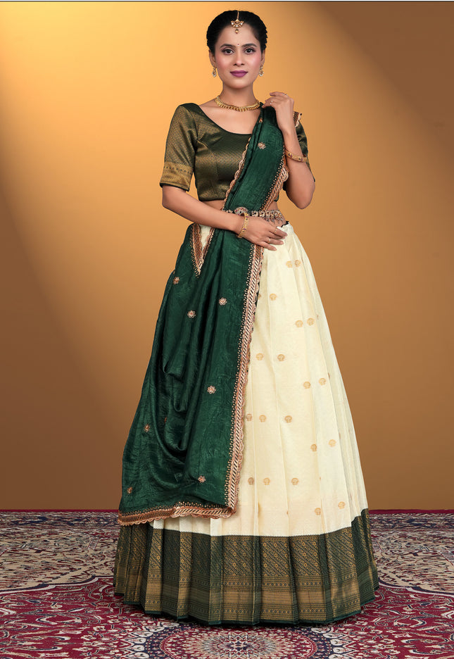 Woman wearing a green and cream traditional outfit
