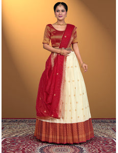 Woman wearing a cream lehenga choli with a Maroon blouse