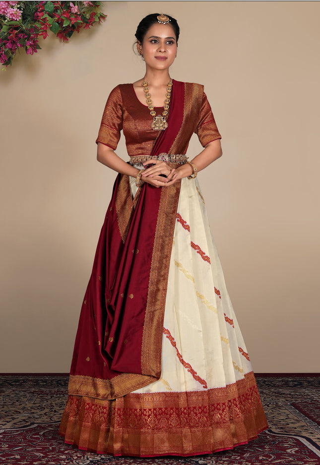 Woman wearing a traditional maroon and white lehenga choli