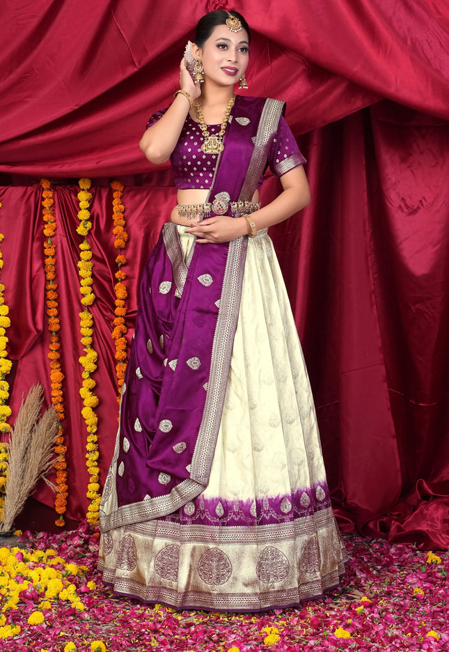 Woman in a traditional purple and white lehenga choli