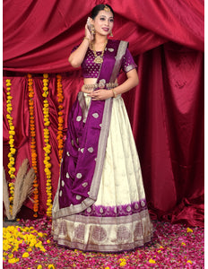 Woman in a traditional purple and white lehenga choli