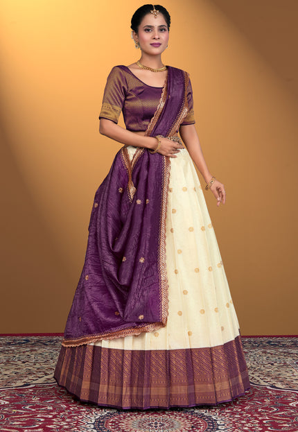 Woman wearing a traditional purple and white lehenga choli