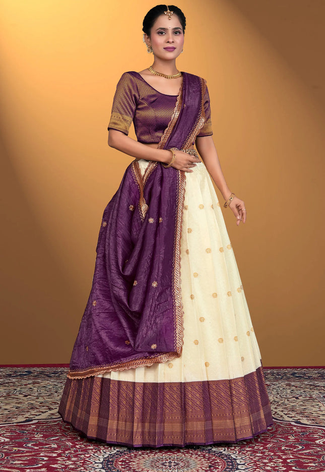 Woman wearing a traditional purple and white lehenga choli