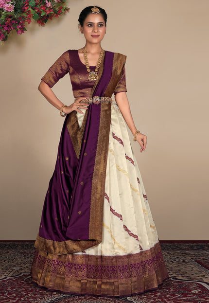 Woman wearing a traditional lehenga choli with a purple and white design