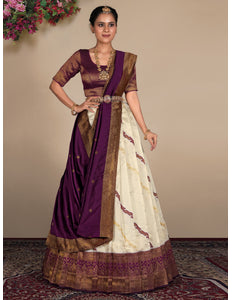 Woman wearing a traditional lehenga choli with a purple and white design
