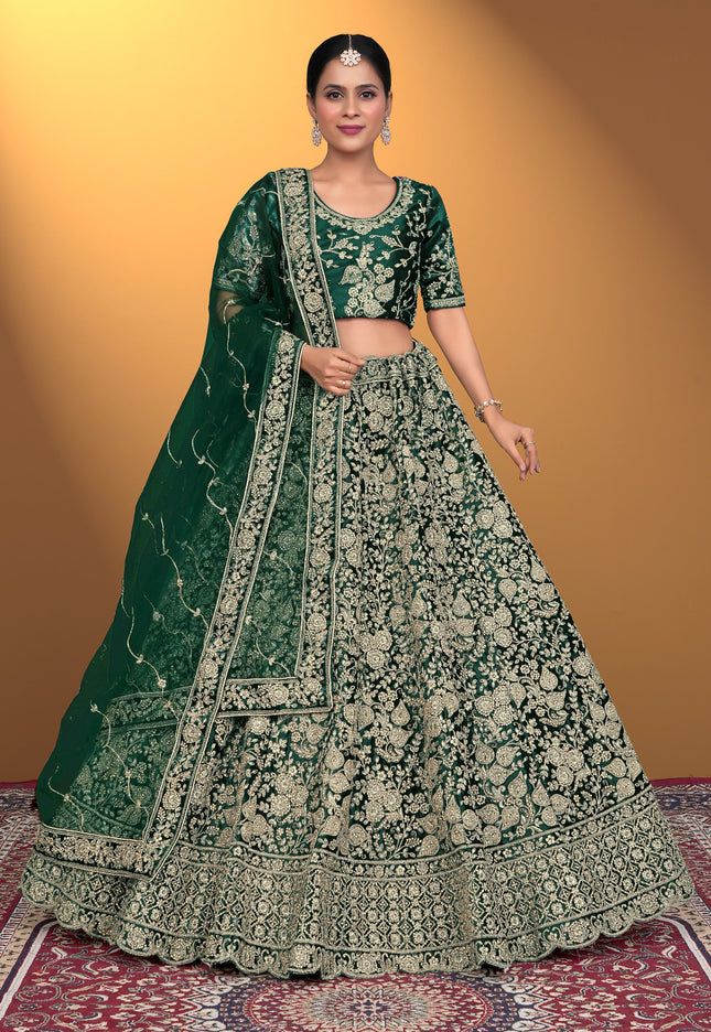 Woman wearing a green embroidered traditional Velvet Lehenga Choli