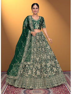 Woman wearing a green embroidered traditional Velvet Lehenga Choli