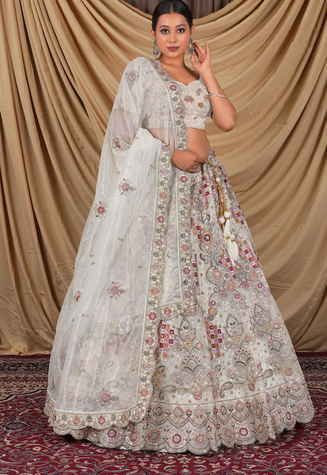 Woman wearing a traditional white embroidered outfit