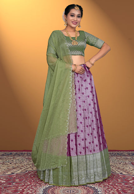 Woman wearing a green and purple traditional outfit