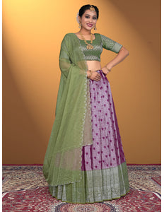 Woman wearing a green and purple traditional outfit