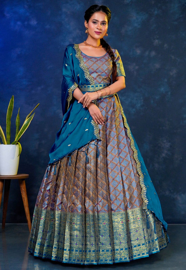 Woman in a blue and patterned lehenga choli with dupatta
