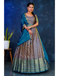 Woman in a blue and patterned lehenga choli with dupatta