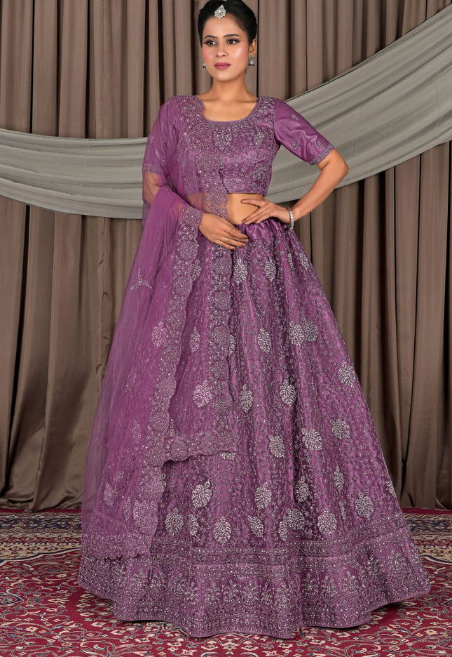 Woman wearing a purple embroidered traditional outfit