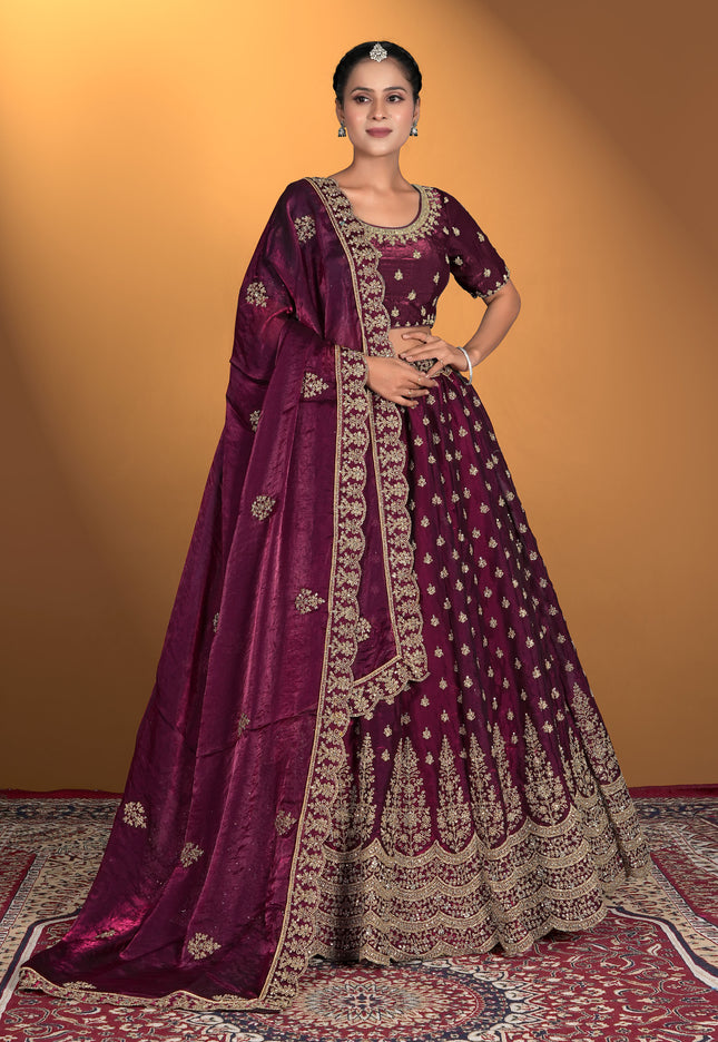 Woman wearing a traditional maroon embroidered dress