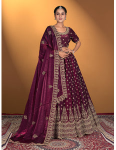Woman wearing a traditional maroon embroidered dress