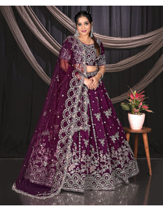Woman in a purple embroidered traditional outfit
