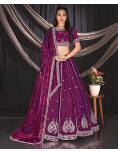 Woman wearing a purple embroidered traditional outfit