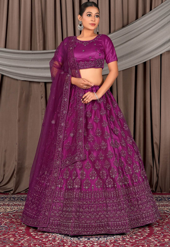 Woman wearing a purple traditional outfit with a patterned design