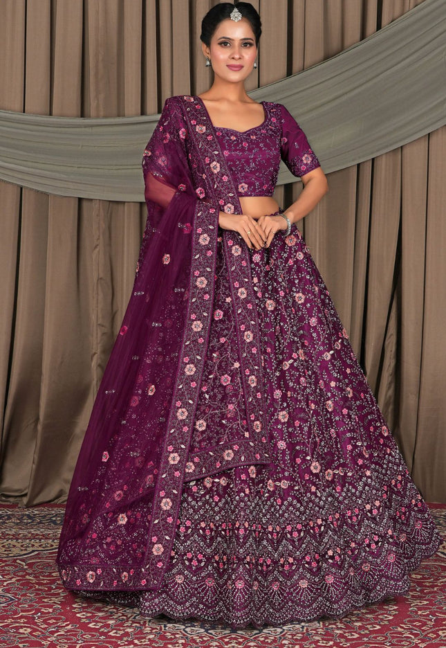 Woman wearing a purple traditional outfit with floral patterns