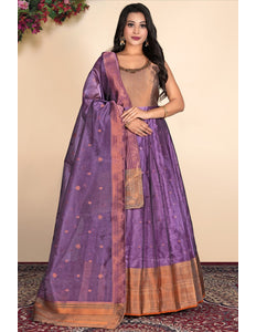 Woman wearing a traditional purple gown with a gold border