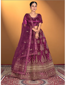 Woman wearing a traditional purple embroidered outfit