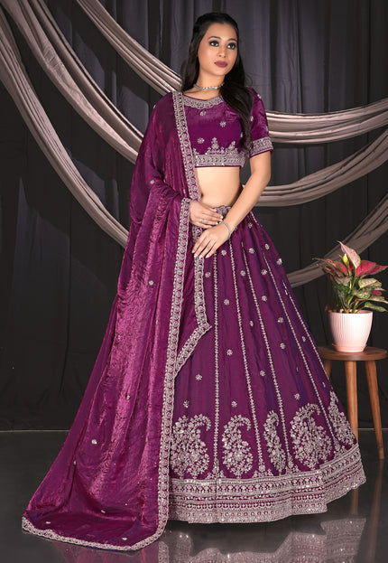 Woman wearing a purple embroidered traditional lehenga choli