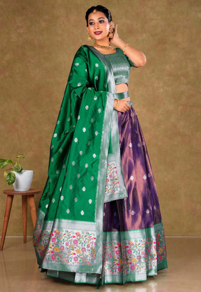 Woman wearing a green and purple traditional outfit with a floral pattern