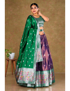 Woman wearing a green and purple traditional outfit with a floral pattern