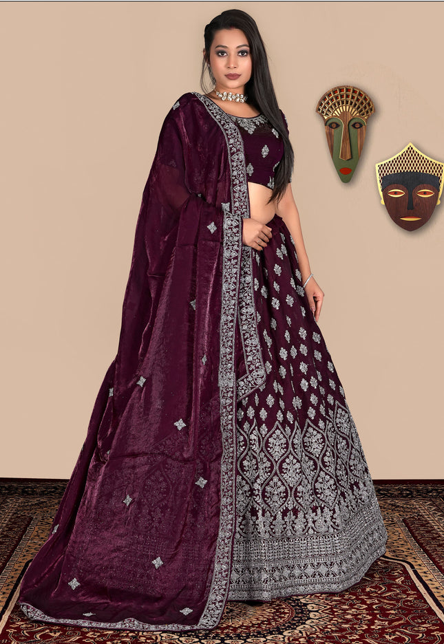 Woman in a Wine lehenga with silver patterns