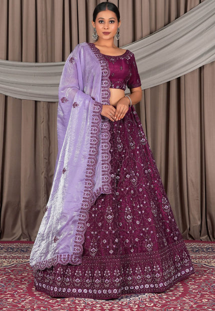 Woman wearing a traditional Purple and lavender embroidered outfit