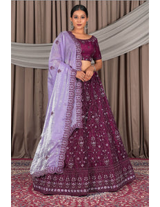 Woman wearing a traditional Purple and lavender embroidered outfit